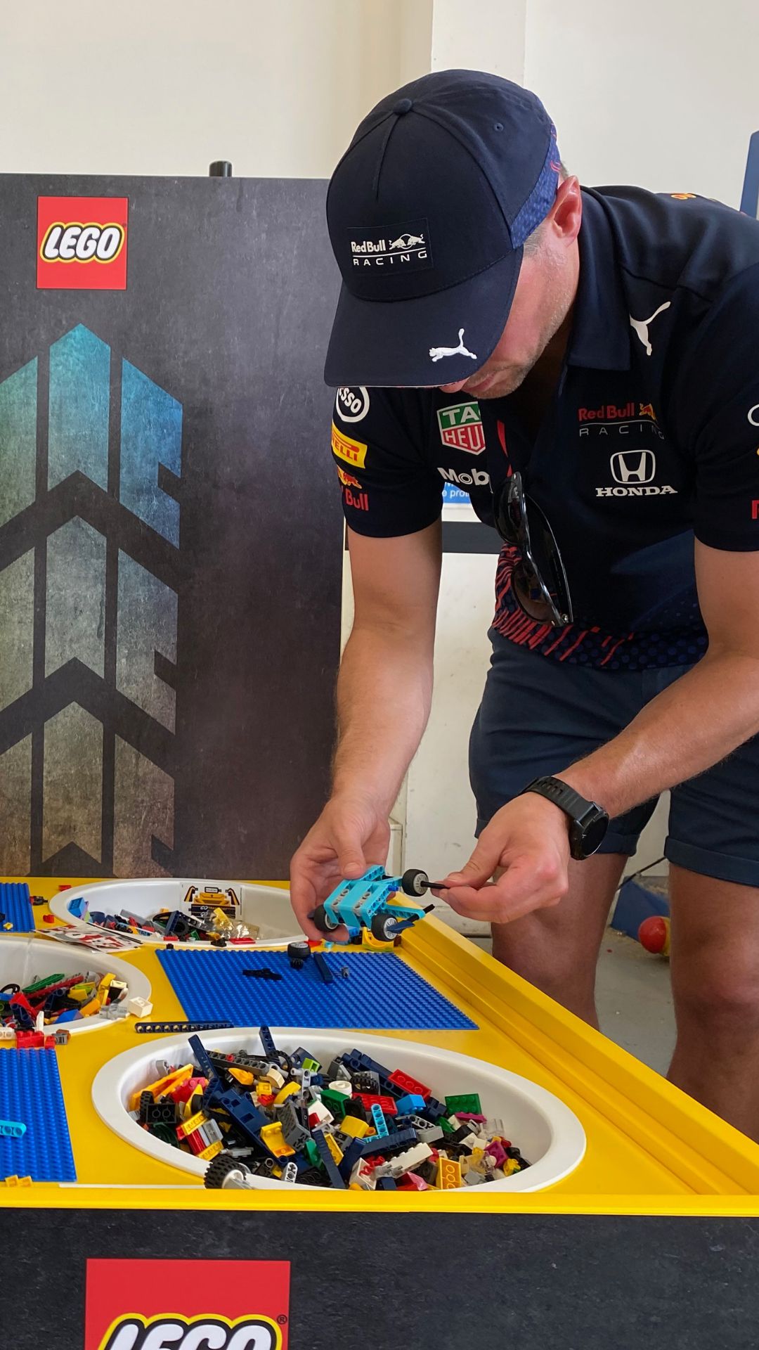 A man assembling some LEGO